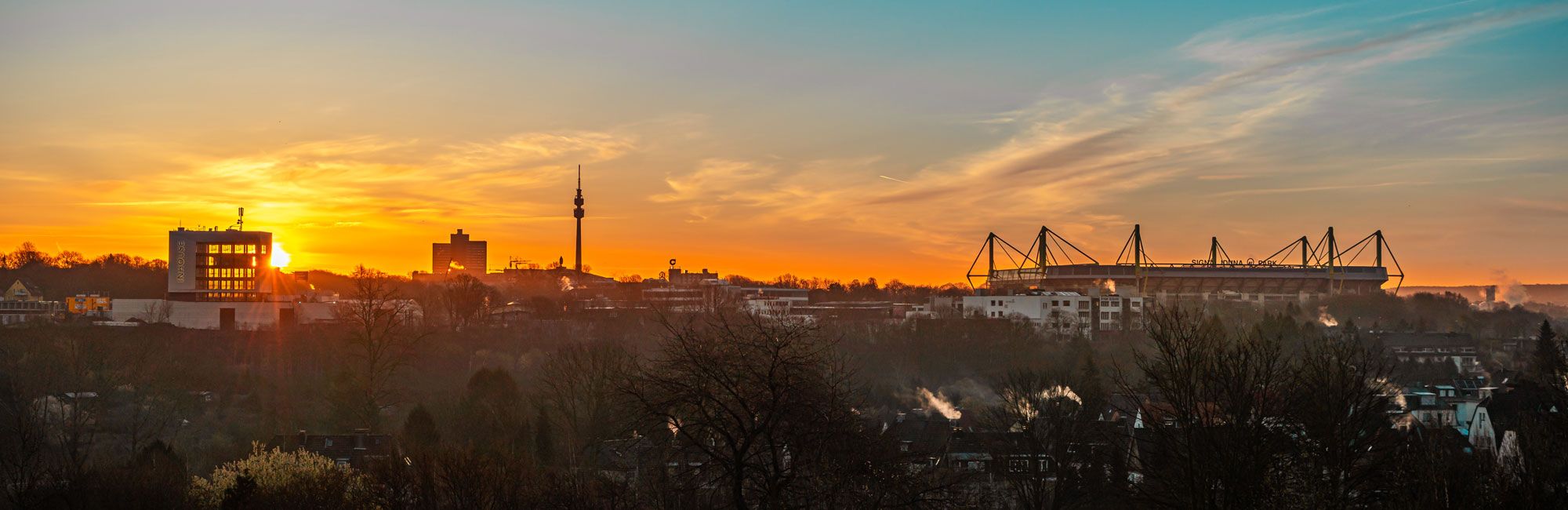 Dr. Claus + Wefers + Kollegen in Dortmund, Panorama Skyline Dortmund beim Sonnenuntergang